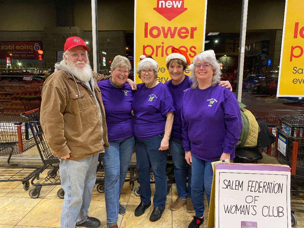 Salem Women’s Federation sings while collecting donations for Salvation